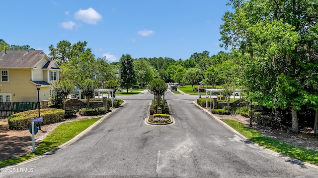 83 Plumgrass St, Bluffton, SC 29910 - view of asphalt street featuring curbs and a gated entry