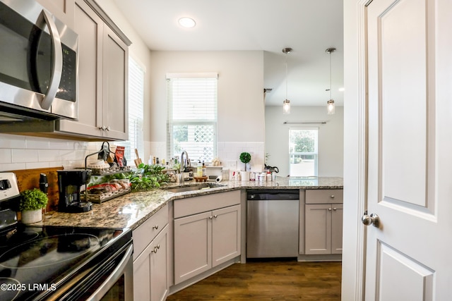 83 Plumgrass St, Bluffton, SC 29910 - kitchen featuring appliances with stainless steel finishes, backsplash, dark wood finished floors, hanging light fixtures, and recessed lighting