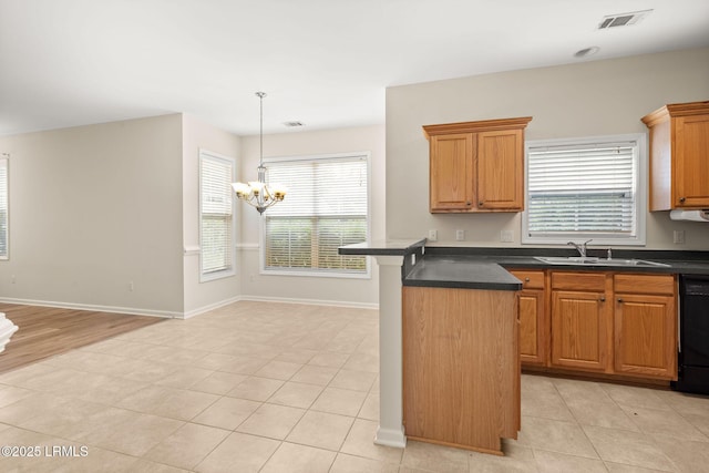 kitchen with visible vents, a sink, a chandelier, and dark countertops