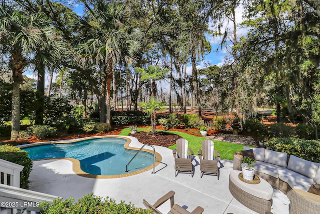 outdoor pool with a patio and outdoor lounge area