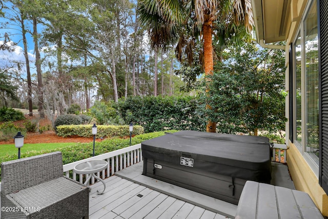 wooden terrace with a covered hot tub