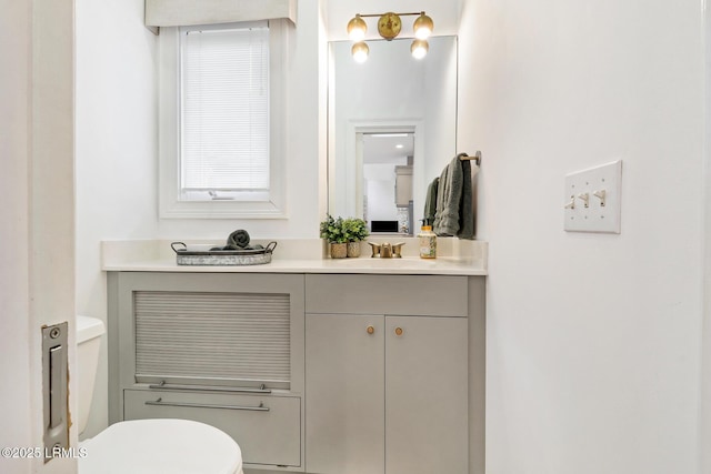 bathroom with vanity and toilet