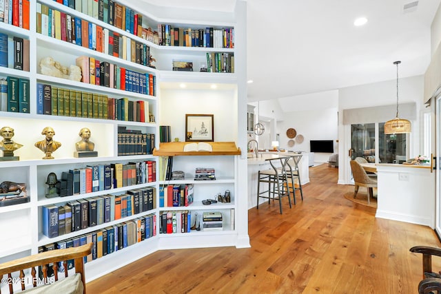 interior space featuring light wood-type flooring, visible vents, and recessed lighting