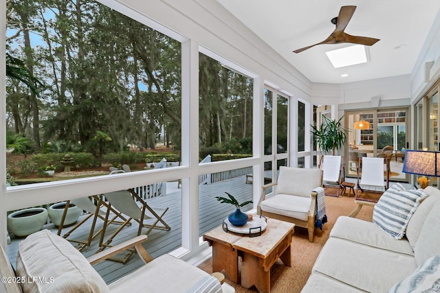 sunroom / solarium with a skylight and ceiling fan