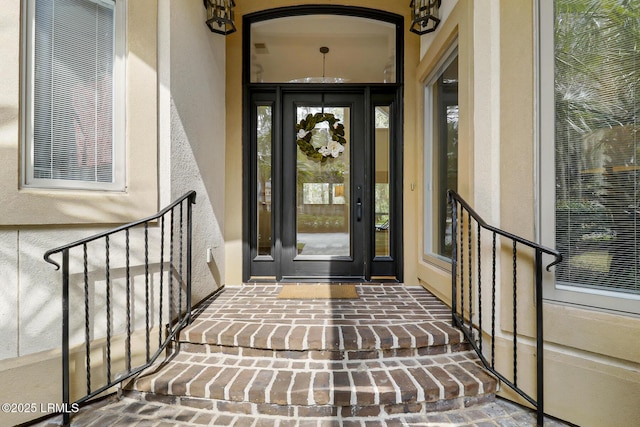 entrance to property with stucco siding