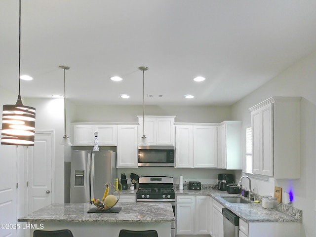 62 Keowee Ln, Beaufort, SC 29906 - kitchen featuring appliances with stainless steel finishes, recessed lighting, white cabinets, a center island, and hanging light fixtures
