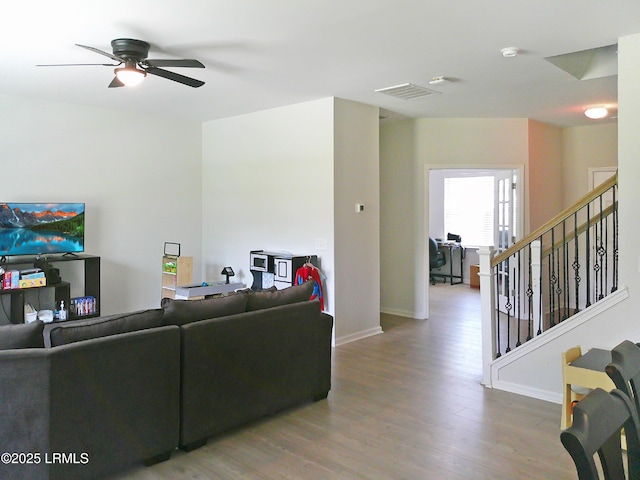 62 Keowee Ln, Beaufort, SC 29906 - living room featuring wood finished floors, ceiling fan, and stairway