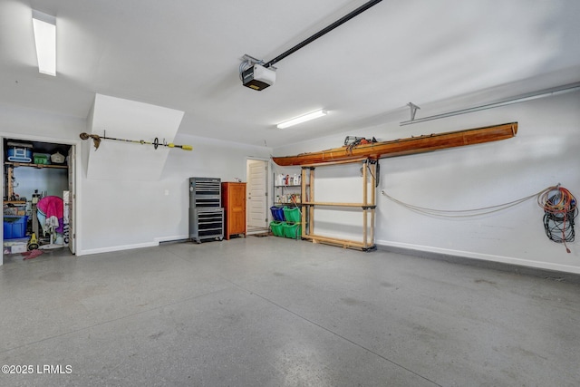 garage featuring baseboards and a garage door opener