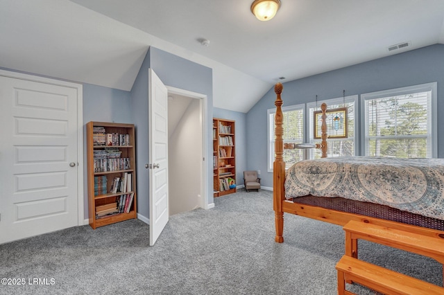 carpeted bedroom featuring visible vents, baseboards, and vaulted ceiling