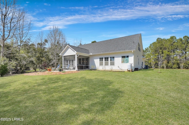 back of property featuring a yard, central AC, a shingled roof, and a sunroom