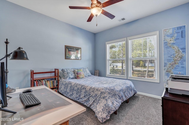 carpeted bedroom featuring baseboards, visible vents, and ceiling fan