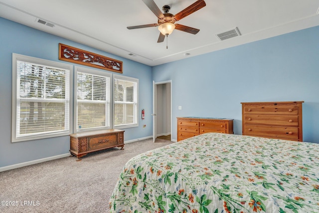 bedroom with carpet, visible vents, and baseboards