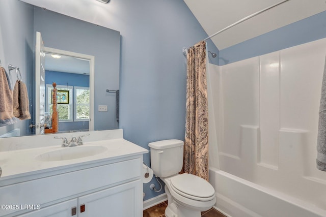 bathroom featuring vanity, toilet, baseboards, and shower / tub combo with curtain