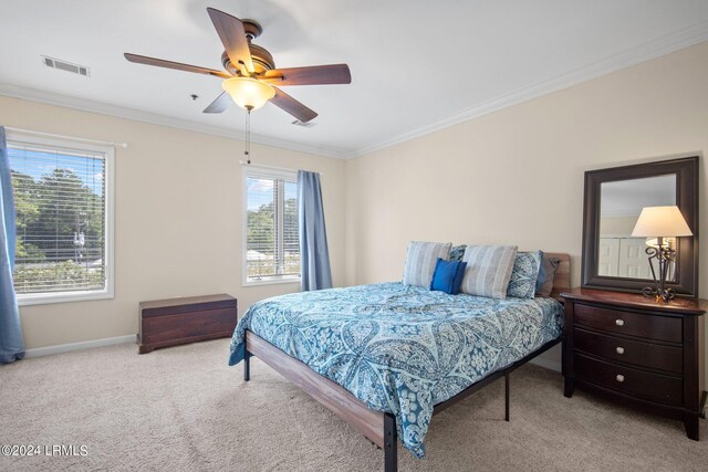 bedroom featuring crown molding, ceiling fan, and light carpet