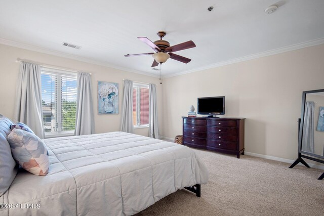 bedroom with crown molding, light carpet, and ceiling fan