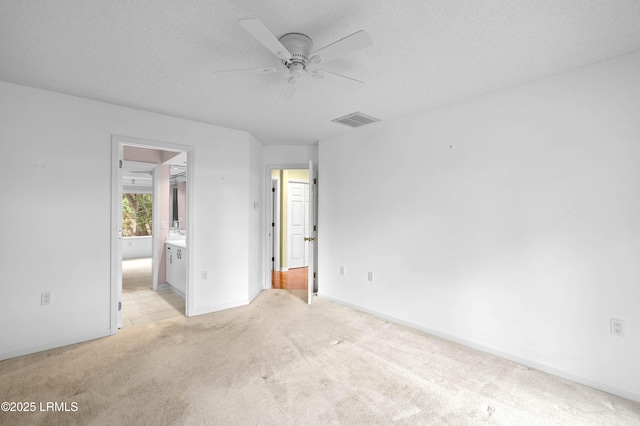 2 Doe Pt, Dataw Island, SC 29920 - unfurnished bedroom featuring light colored carpet and ensuite bath