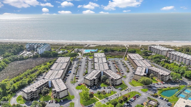 aerial view with a water view and a beach view