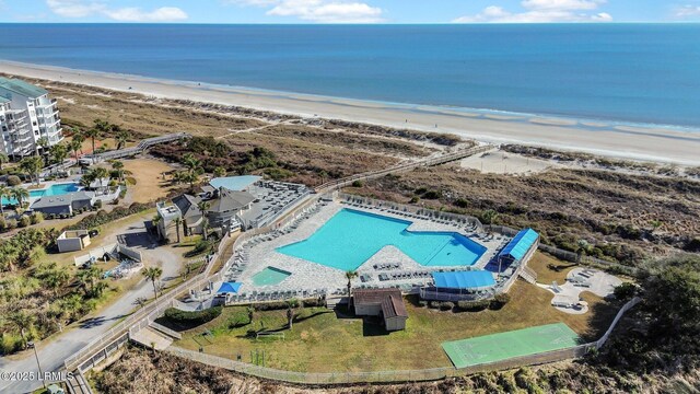 bird's eye view with a water view and a beach view