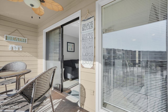 balcony featuring ceiling fan