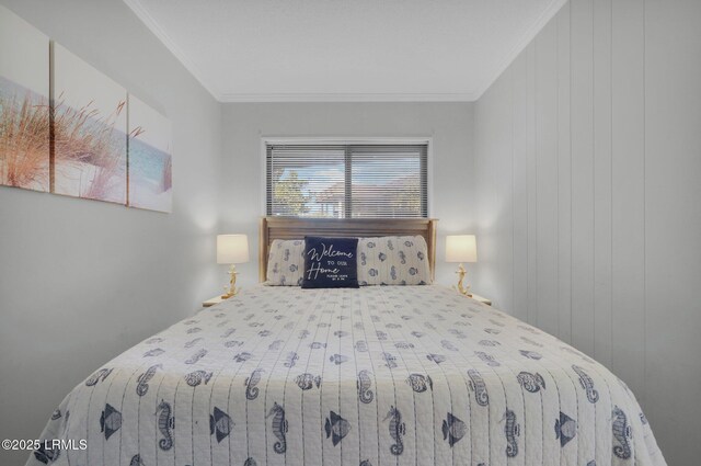 unfurnished bedroom featuring ornamental molding and wood walls