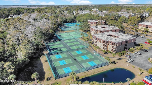 birds eye view of property with a water view