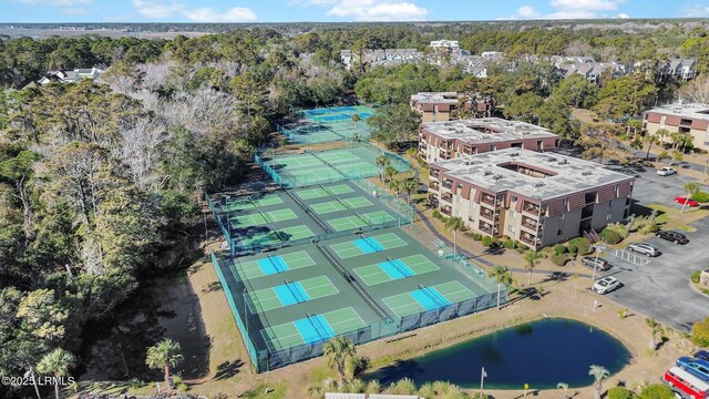 birds eye view of property with a water view