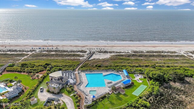 aerial view featuring a water view and a beach view