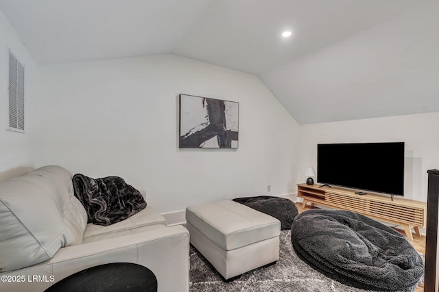 living room with vaulted ceiling