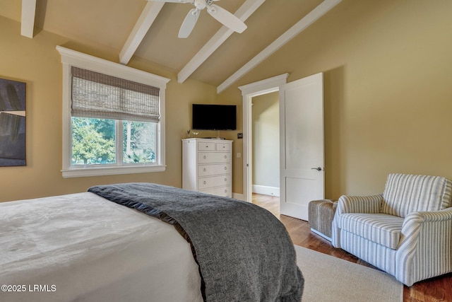 bedroom featuring ceiling fan, dark hardwood / wood-style floors, and lofted ceiling with beams