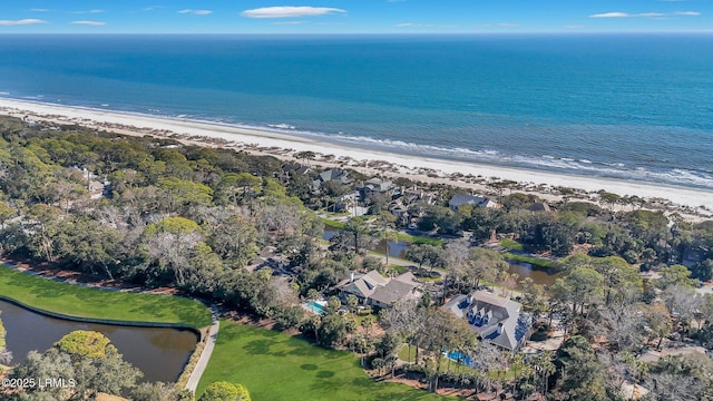 drone / aerial view featuring a water view and a view of the beach