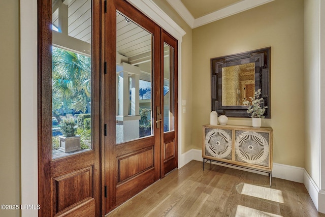 entryway featuring light hardwood / wood-style flooring and ornamental molding