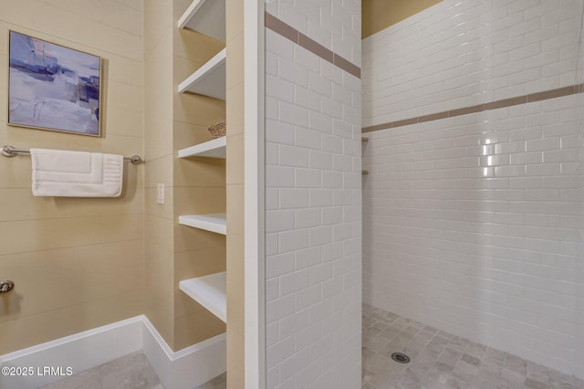 bathroom with tiled shower