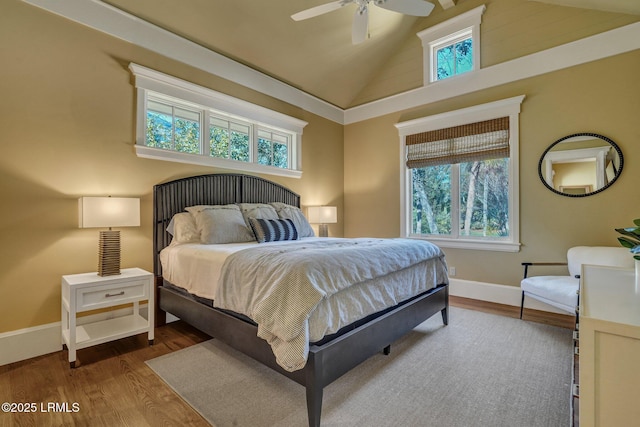 bedroom featuring lofted ceiling, hardwood / wood-style floors, and ceiling fan