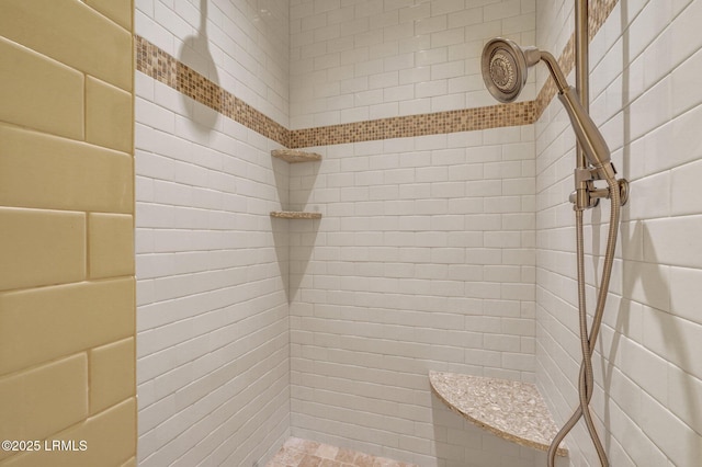 bathroom with tiled shower