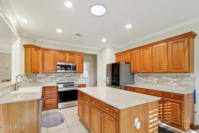 kitchen with light tile patterned floors, sink, stainless steel appliances, tasteful backsplash, and ornamental molding