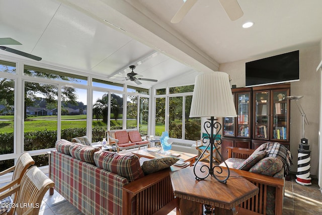 sunroom / solarium with ceiling fan and lofted ceiling