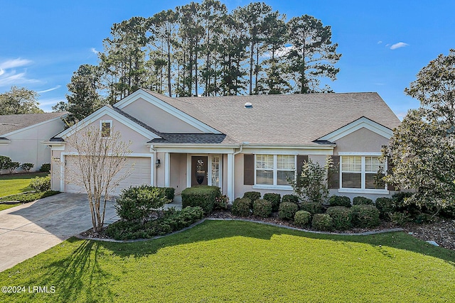 ranch-style home with a garage and a front lawn