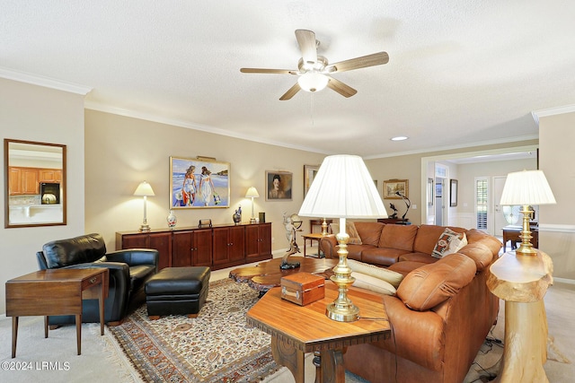 living room featuring a textured ceiling, ornamental molding, and ceiling fan