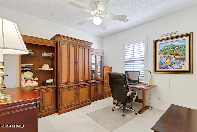 office with light carpet, a textured ceiling, and ceiling fan