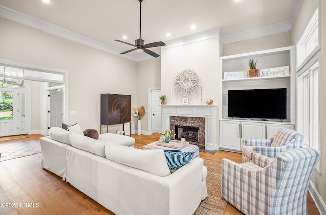 1 Wild Magnolia Ct, Okatie, SC 29909 - living room featuring crown molding, light wood finished floors, recessed lighting, a premium fireplace, and a ceiling fan