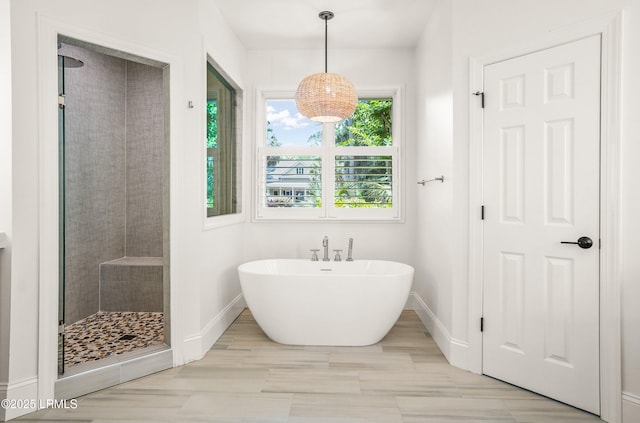 1 Wild Magnolia Ct, Okatie, SC 29909 - bathroom featuring baseboards, a soaking tub, and a stall shower