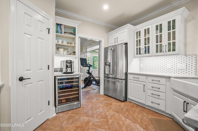 1 Wild Magnolia Ct, Okatie, SC 29909 - kitchen featuring high end refrigerator, beverage cooler, crown molding, white cabinetry, and backsplash