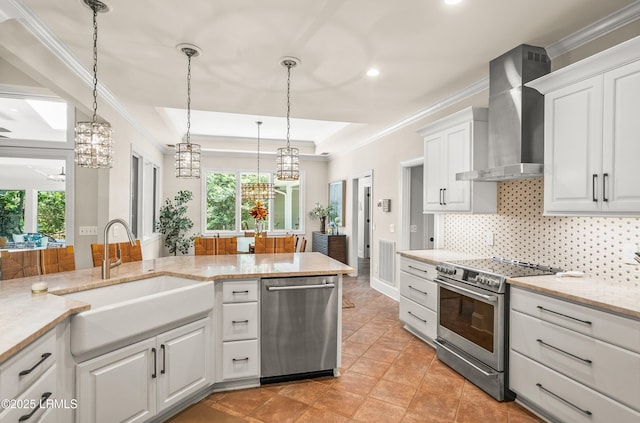 1 Wild Magnolia Ct, Okatie, SC 29909 - kitchen with stainless steel appliances, a sink, wall chimney range hood, ornamental molding, and tasteful backsplash