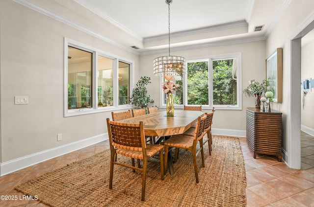 1 Wild Magnolia Ct, Okatie, SC 29909 - dining space with a chandelier, crown molding, baseboards, a raised ceiling, and light tile patterned floors