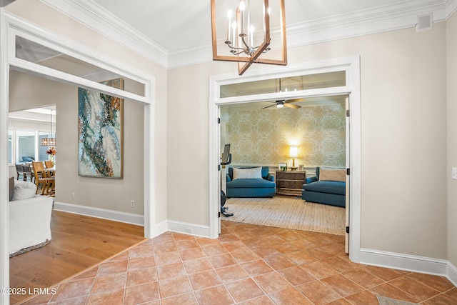 1 Wild Magnolia Ct, Okatie, SC 29909 - entrance foyer featuring wallpapered walls, baseboards, crown molding, a chandelier, and an accent wall
