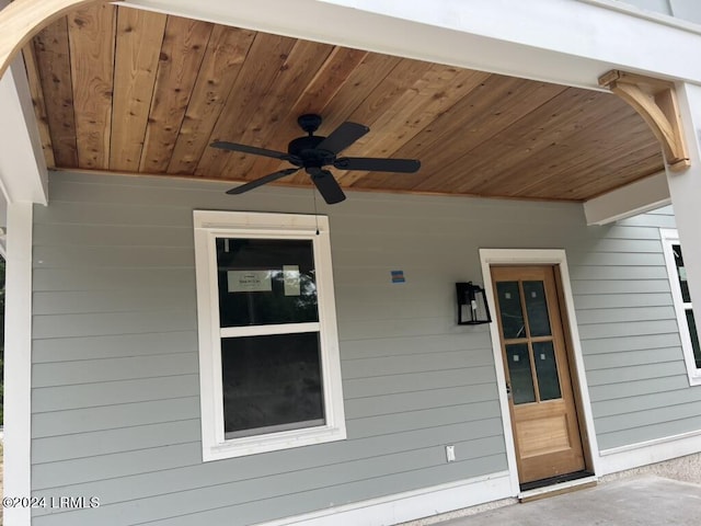 exterior space with ceiling fan