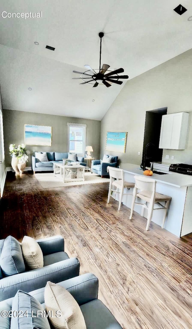 living room with lofted ceiling, sink, light hardwood / wood-style floors, and ceiling fan