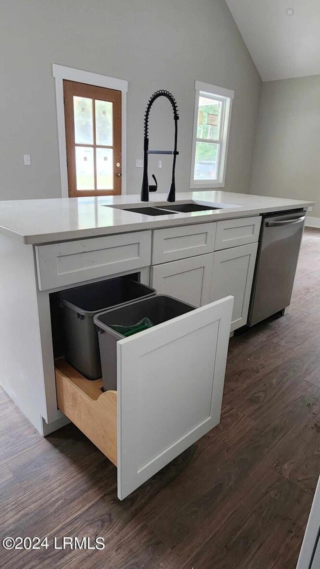 kitchen with white cabinetry, sink, dark hardwood / wood-style flooring, and stainless steel dishwasher