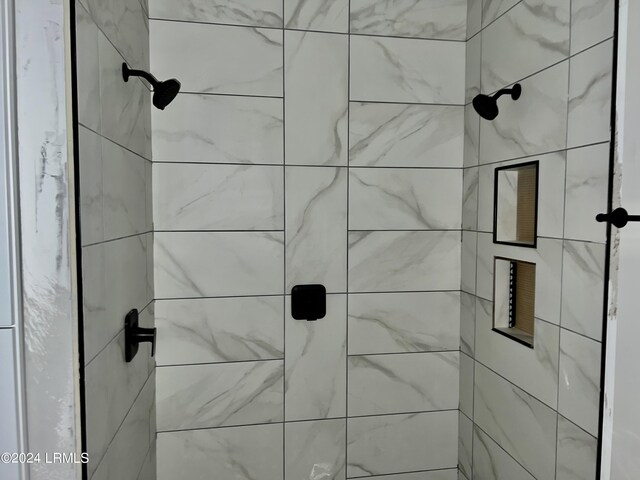 bathroom with tiled shower