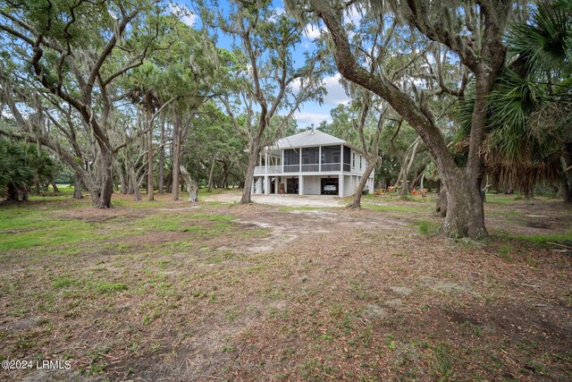 view of yard with a sunroom